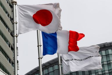 Flags of Japan, France and Nissan are seen at Nissan Motor Co.'s global headquarters in Yokohama