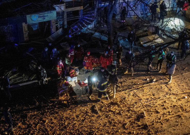 Rescuers work at the site where an apartment building was heavily damaged by a Russian missile strike in Kharkiv