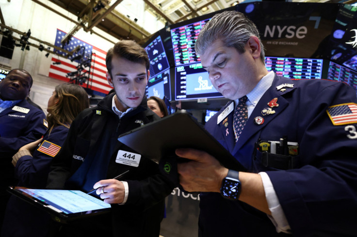 Traders work on the trading floor at the New York Stock Exchange (NYSE) in New York City