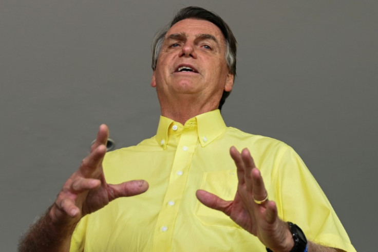 Brazil's then President Jair Bolsonaro speaks to the media in October 2022 during a meeting with country singers at the Alvorada Palace in Brasilia