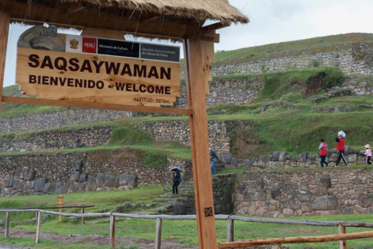A handful of tourists visit the Sacsahuaman Inca ruins in Cusco, where 95 percent of hotel rooms have been cancelled due to the anti-government protests
