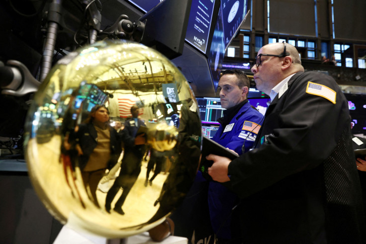 Traders work on the trading floor at the New York Stock Exchange (NYSE) in New York City