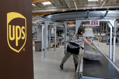 An United Parcel Service employee works at the new package sorting and delivery UPS hub in Corbeil-Essonnes and Evry