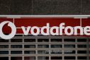 The logo of Vodafone is seen on the facade of a store in Ronda