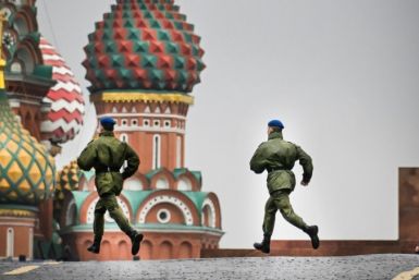 Russian soldiers run along Red Square on September 29, 2022 prior to a ceremony announcing the incorporation of Ukrainian territories into Russia