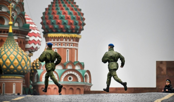 Russian soldiers run along Red Square on September 29, 2022 prior to a ceremony announcing the incorporation of Ukrainian territories into Russia