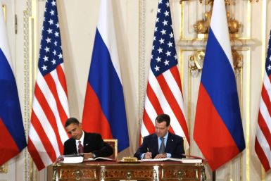 Barack Obama and Dmitry Medvedev, the the presidents of the United States and Russia, sign the New START treaty in Prague on April 8, 2010