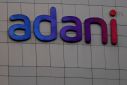 The logo of the Adani Group is seen on the facade of its Corporate House on the outskirts of Ahmedabad