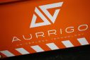 A company logo is seen on the side of an autonomous ‘Auto-Shuttle’ vehicle inside the Aurrigo factory in Coventry
