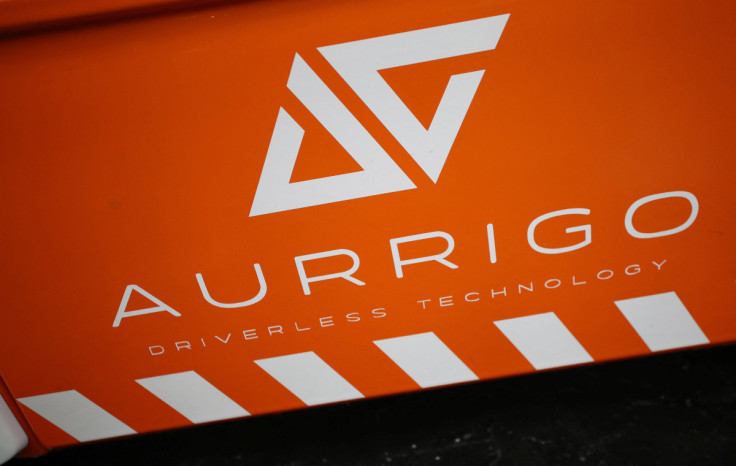 A company logo is seen on the side of an autonomous ‘Auto-Shuttle’ vehicle inside the Aurrigo factory in Coventry