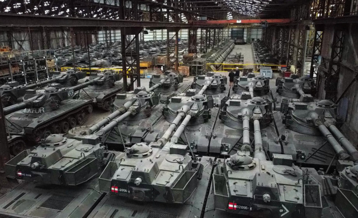 Armoured vehicles are seen in an hangar in Tournais