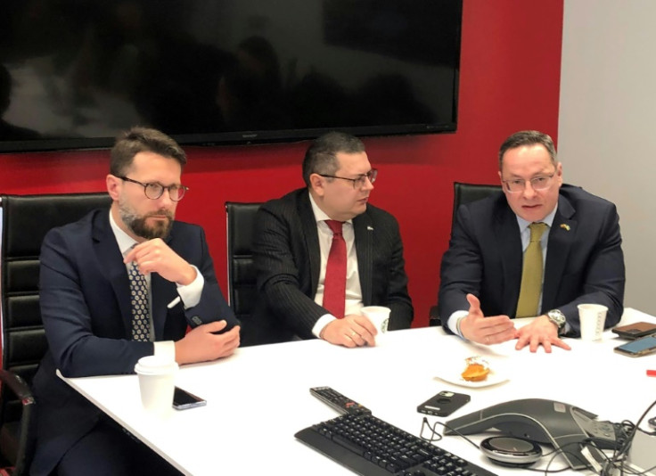 Radoslaw Fogiel (left), Oleksandr Merezhko (center) and Zygimantas Pavilionis, the chairs of the parliamentary foreign affairs committee respectively of Poland, Ukraine and Lithuania, speak to reporters from the State Department Correspondents' Associatio