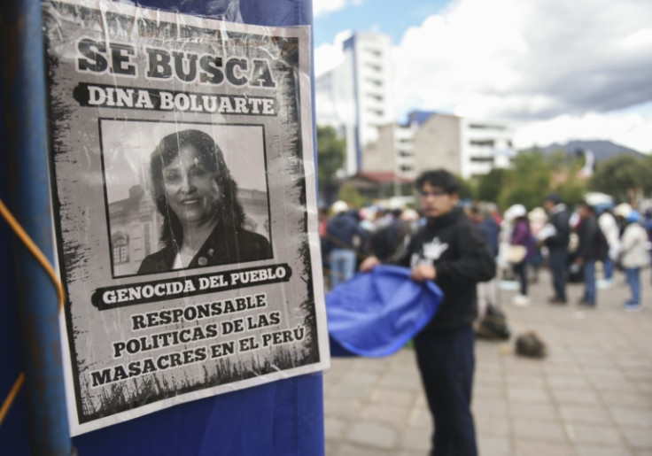 Protesters demand the resignation of President Dina Boluarte, pictured here on a makeshift 'wanted' poster accusing her of 'genocide'