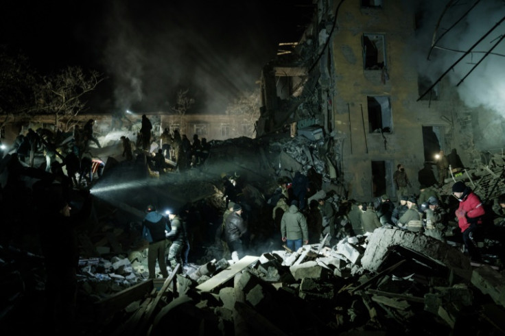 Rescuers search for survivors at an apartment building hit by a rocket in Kramatorsk in the Donetsk region