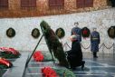 Russian President Vladimir Putin lays a wreath at a World War II memorial in Volgograd