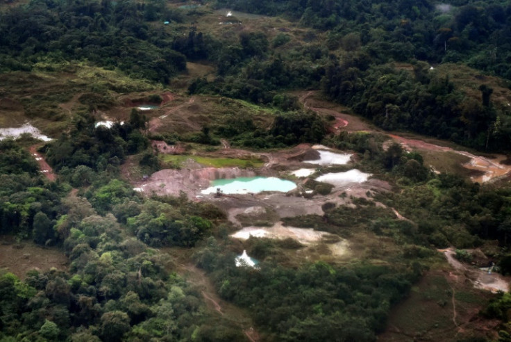 Aerial view of a pool of mercury-contaminated water at an illegal gold mine in Triangulo de Telembi