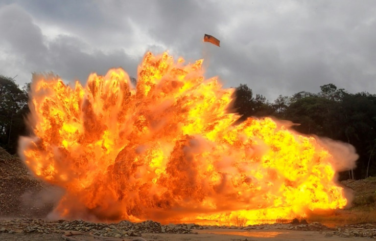 Screen grab of an explosion that destroys heavy machinery at an illegal gold mine in Triangulo de Telembi
