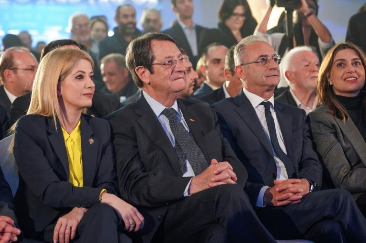 Outgoing President Nikos Anastasiades (centre left) sits next to head of the ruling Democratic Rally (DISY) and presidential candidate Averof Neofytou during an election rally
