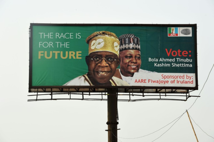 Ruling APC party candidate Bola Tinubu, seen here on a campaign poster, says the fuel and cash crisis is a bid to undermine him