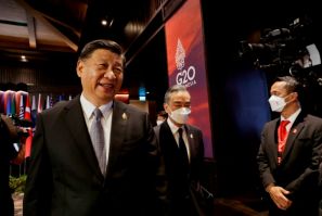 China's President Xi Jinping and China's then Foreign Minister Wang Yi attend the G20 summit in Bali on November 16, 2022