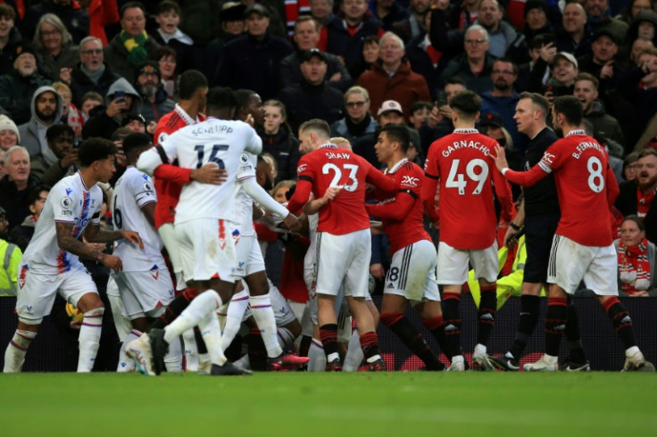 Clash: Players scuffle leading to a red card for Manchester United's Casemiro