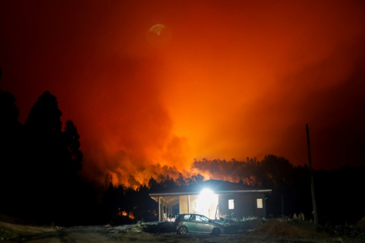 Raging forest fires light up night skies over Santa Juana, Chile on February 3, 2023; it is one of the cities hardest-hit by a series of fires amid scorching temperatures