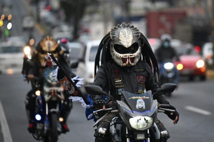 Masks, fancy helmets and banners are de rigeur for the pilgrimage