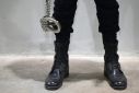 A security guard carrying shackles at the sprawling new prison in Tecoluca, El Salvador