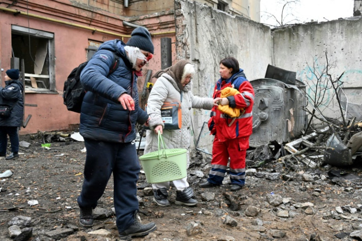 Kharkiv residents leave their homes after a Russian missile strike