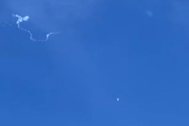 This still image taken from a cellphone video by Haley Walsh in Myrtle Beach, South Carolina, shows a suspected Chinese surveillance balloon after it was shot down on February 4, 2023
