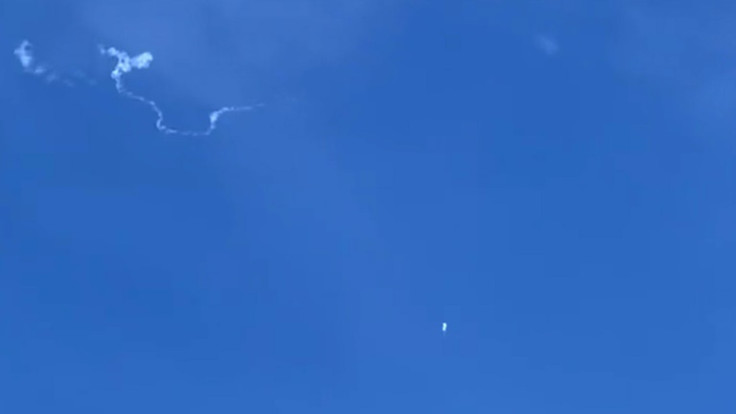 This still image taken from a cellphone video by Haley Walsh in Myrtle Beach, South Carolina, shows a suspected Chinese surveillance balloon after it was shot down on February 4, 2023