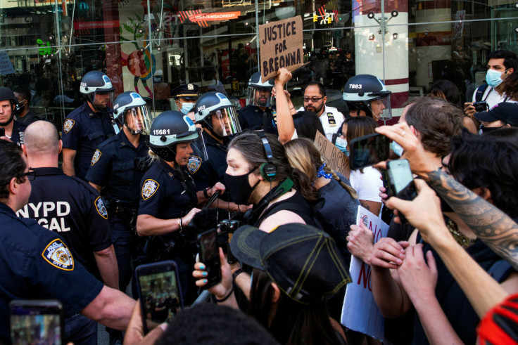 Demonstrators scuffle with NYPD police officers as they try to march trough Times Square during a protest against racial inequality in the aftermath of the death in Minneapolis police custody of George Floyd, in New York City, New York