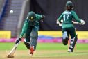 Pakistan's Bismah Maroof (L) makes her ground during a T20 match against India at the Commonwealth Games