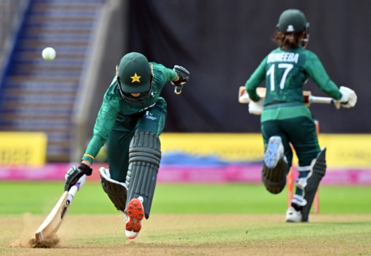 Pakistan's Bismah Maroof (L) makes her ground during a T20 match against India at the Commonwealth Games