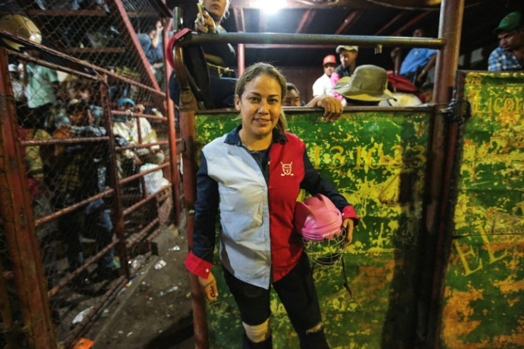 Bull rider Eveling Perez poses for a picture before performing on a traditional bull riding event