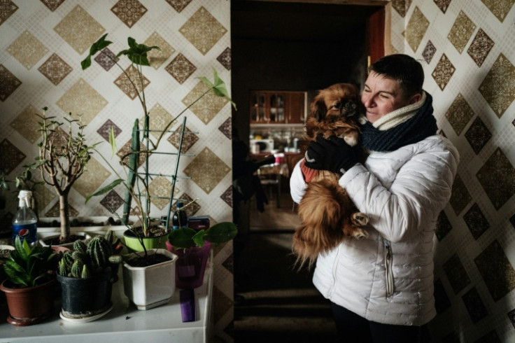 Victoria Shypko and her dog Knopka have seen the village of Yampil change hands twice between Ukrainian and pro-Russian forces