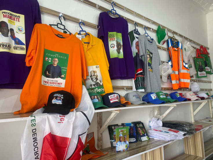 Branded T-shirts, baseball caps and notebooks with images of Nigerian presidential candidates are displayed at a shopping center in Abuja