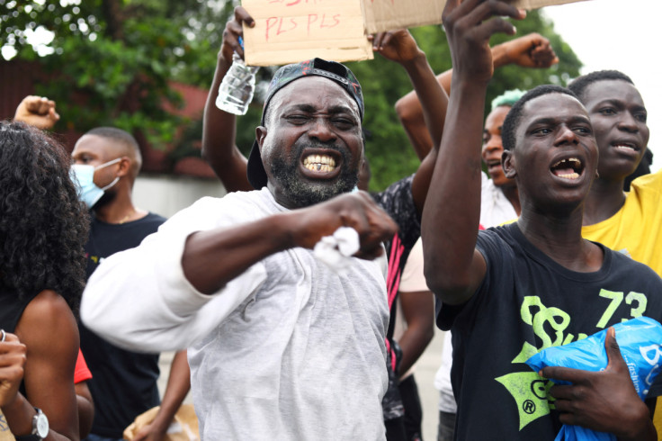 Nigerians take part in a protest against alleged violence, extortion and harrassment from Nigeria's Special Anti-Robbery Squad (SARS), in Lagos