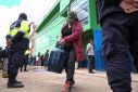 People line up to buy domestic gas after weeks of anti-government protests impacting goods, transport, business and the operation of some key mines, in Cuzco