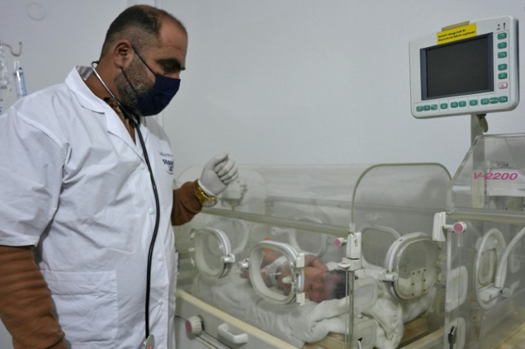 The baby is checked by Doctor Hani Maaruf at a clinic in the Syrian city of Afrin