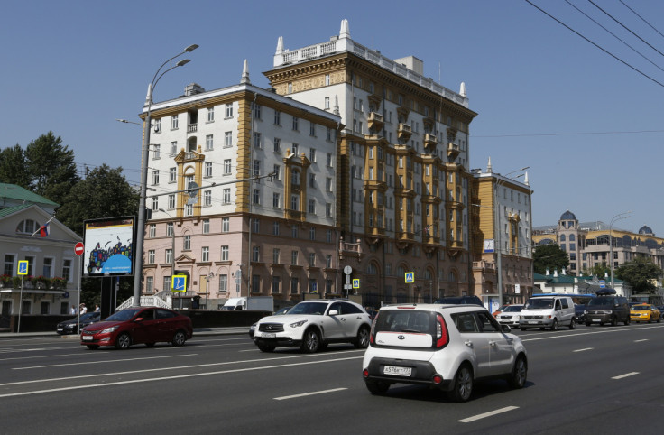 Vehicles drive past the embassy of the U.S. in Moscow
