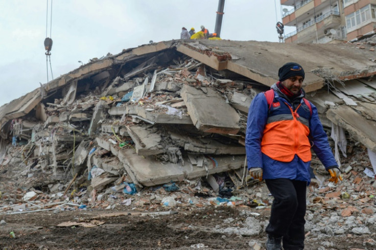 An 11-floor apartment tower has turned into slabs of concrete rubble in Turkey's Diyarbakir