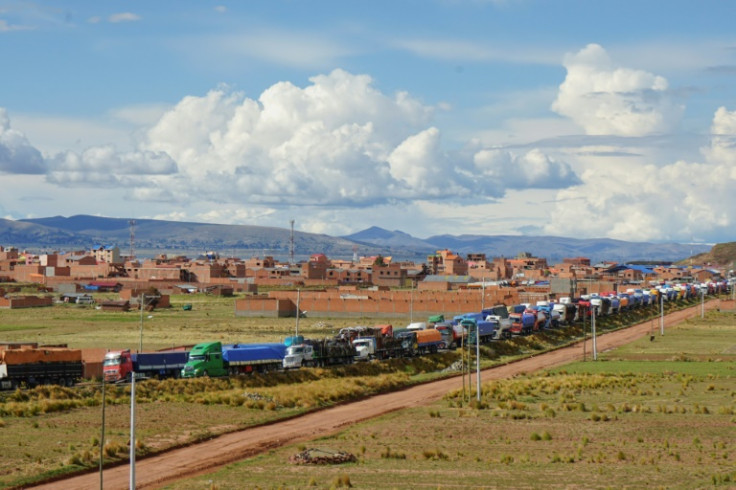 A queue of more than 300 trucks wait to cross from Peru into Bolivia as road blocks cause havoc with haulage vehicles