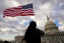 mA flag is held aloft at the U.S. Capitol in Washington
