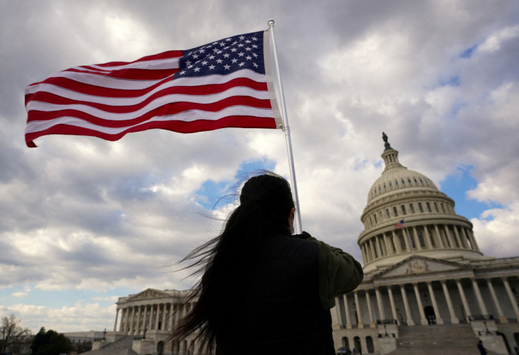 mA flag is held aloft at the U.S. Capitol in Washington