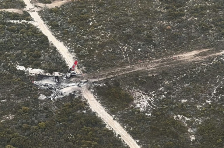 Two pilots made a 'miraculous' escape after their Boeing 737 water-bombing plane crashed and burned while fighting a blaze in remote Western Australia