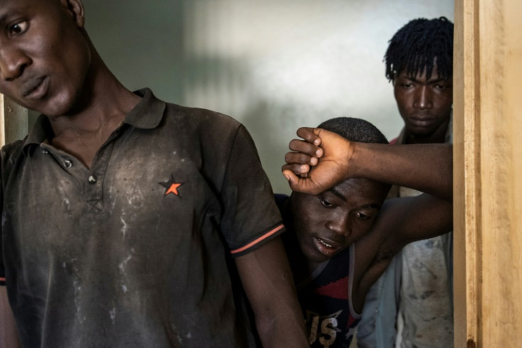 Construction workers from West Africa return to their accommodation after a 12-hour shift in Diamniadio, Senegal's new city