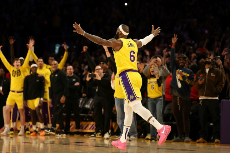 LeBron James celebrates after breaking Kareem Abdul-Jabbar's record as the NBA's all-time leading scorer