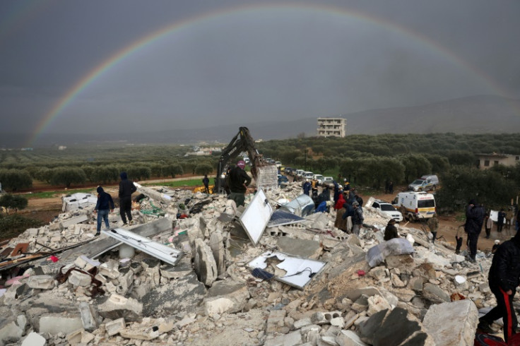 Residents of Besnaya search the rubble for victims and survivors