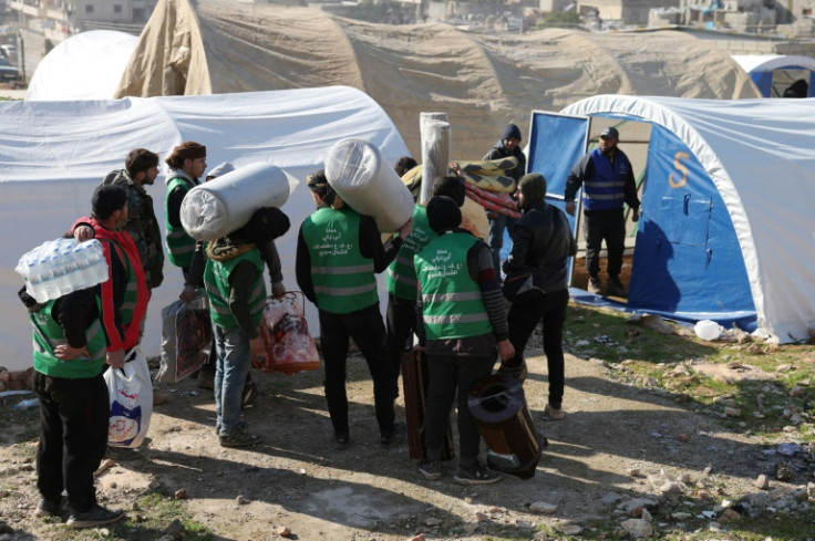 Syrians flock to a camp for the homeless in Harim in Syria's rebel-held northwestern Idlib province following the devastating earthquake